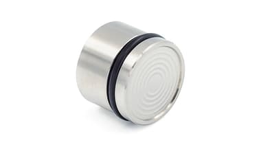 Metallzylinder mit geriffelter Oberfläche.