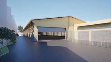 Aussenansicht eines modernen Gebäudekomplexes mit offenem Tor.