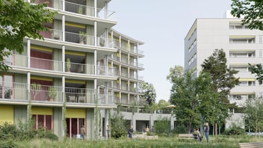 Moderne Wohngebäude mit Grünflächen und Bäumen.