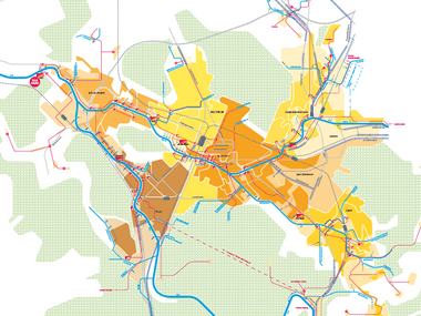 Farbige schematische Karte einer Stadt mit Strassen und Linien.