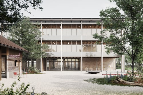 Moderne Gebäude mit Glasfassade, umgeben von Bäumen.
