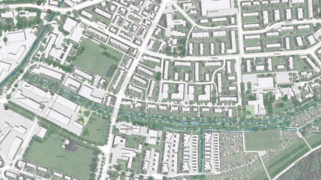 Satellitenansicht einer Stadt mit Gebäuden und Strassen.