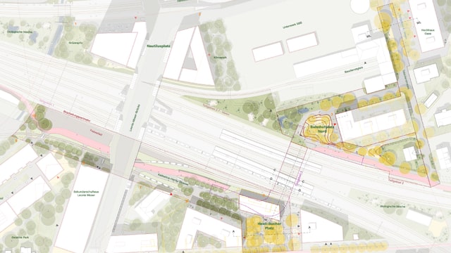 Stadtplan mit Eisenbahngleisen, Strassen und Gebäuden.